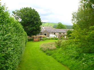 View from orchard looking South towards Redmain House, Huddlestone Cottage and The Hayloft
