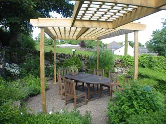Private seating area in the herb garden under the Pergola