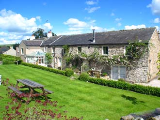 Huddlestone Cottage and The Hayloft viewed from the terrace lawn area