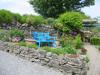 Seat to relax and enjoy the rose garden