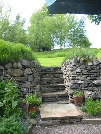 Stone steps lead from the herb garden up towards Betty's Border