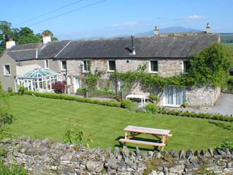 View of lawn behind Huddlestone Cottage and The Hayloft