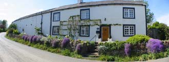 Redmain House and attached barn viewed from the front