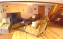 Huddlestone Cottage living room with open log fire