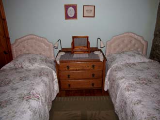 Twin bedded room with lofted ceiling