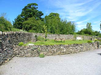 View of gardens and parking from the entrance gate