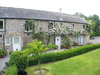 Huddlestone Cottage and The Hayloft viewed from the lawn
